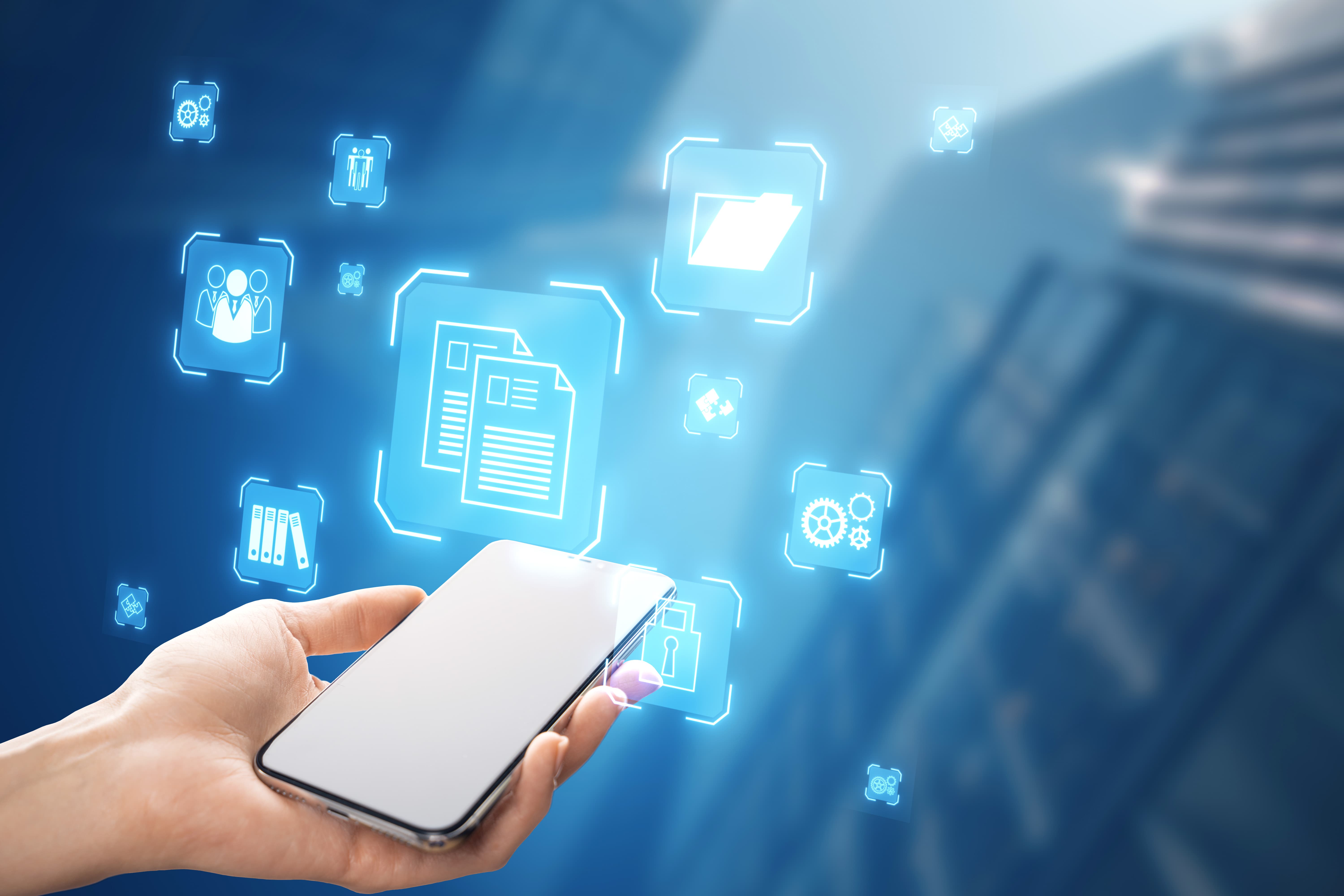 close-up-female-hand-holding-smartphone-with-glowing-blue-icons-blurry-city-background-online-management-remote-work-co.jpg